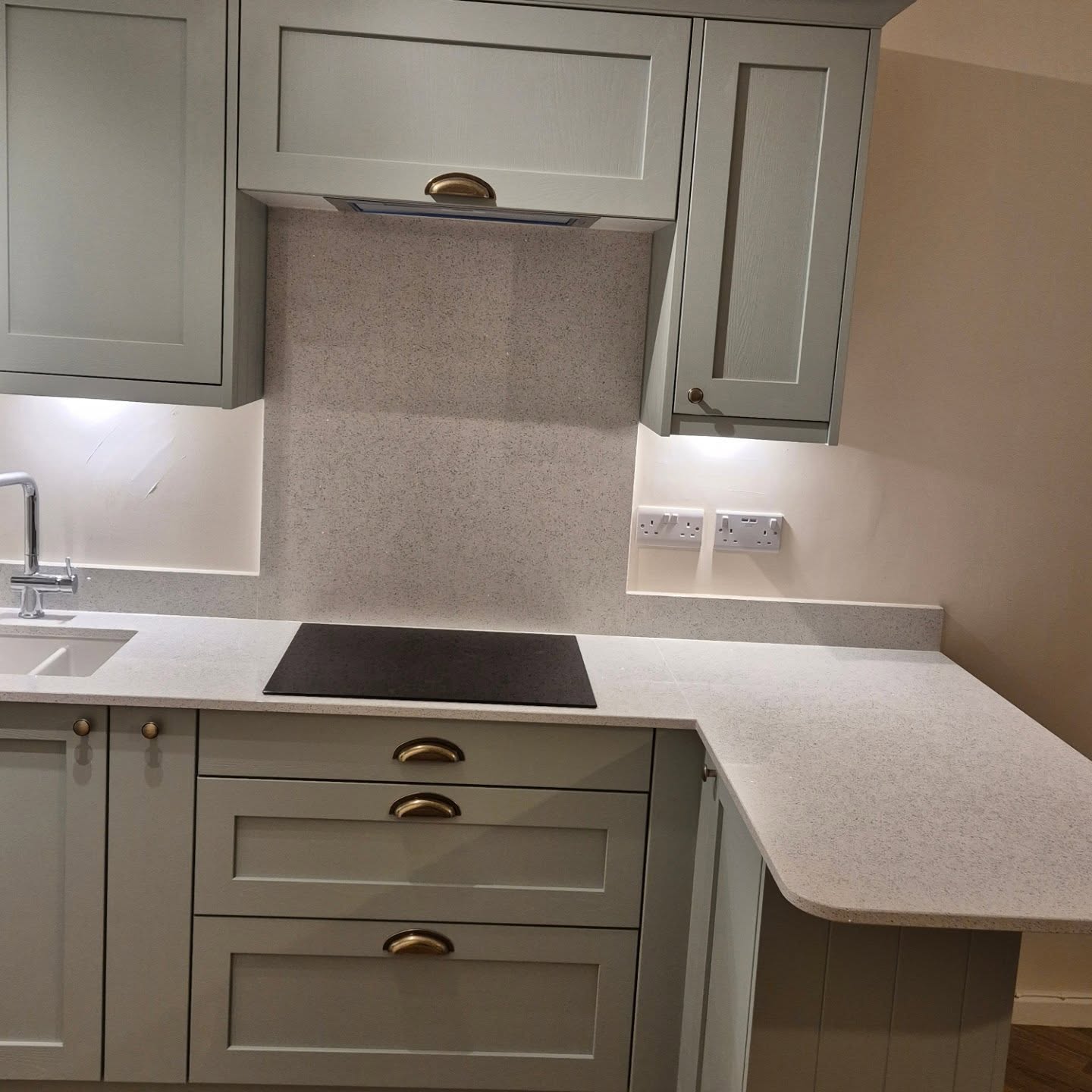 Sage green Shaker-style fitted kitchen installed by Paul Lynam in Bath