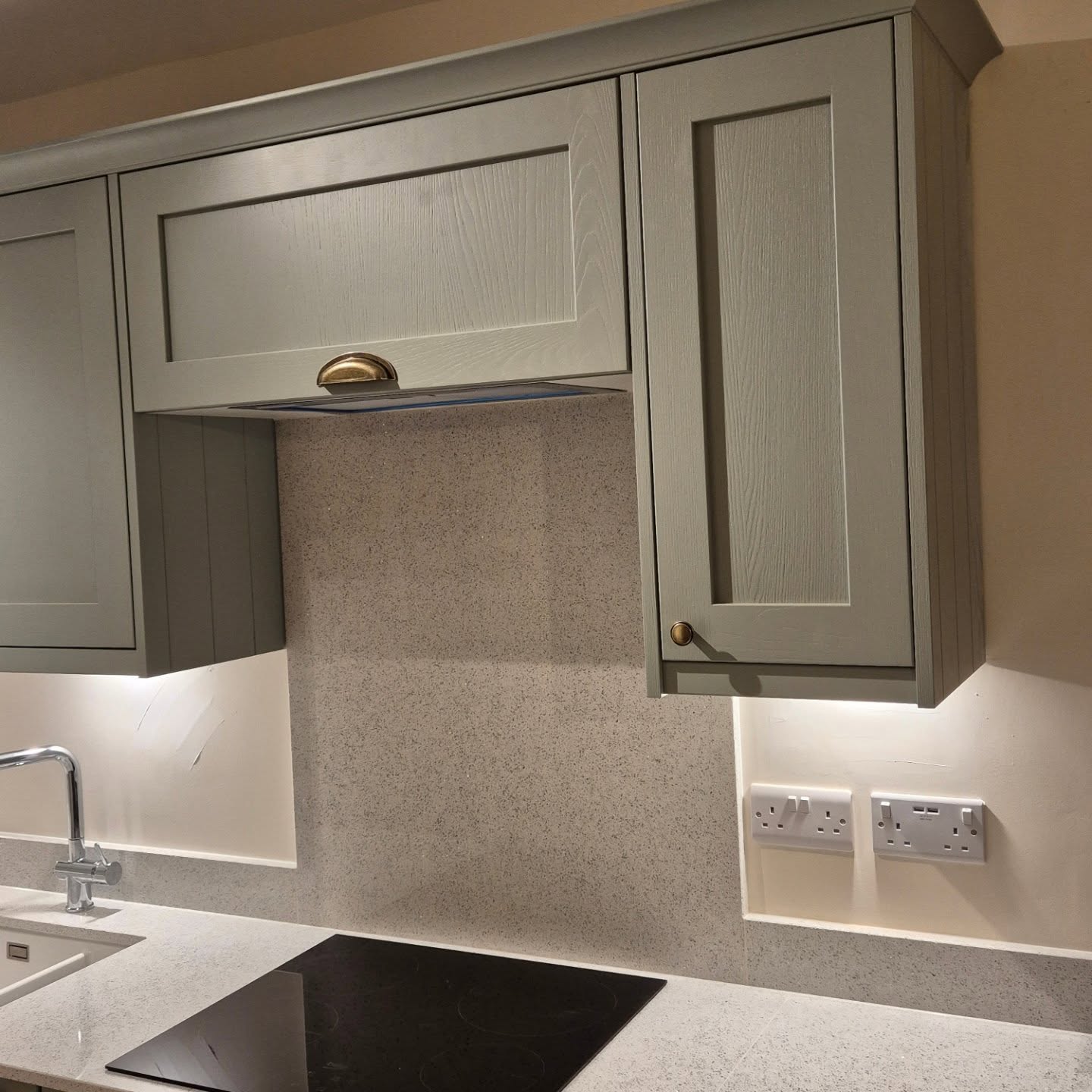 Sage green Shaker-style fitted kitchen installed by Paul Lynam in Bath