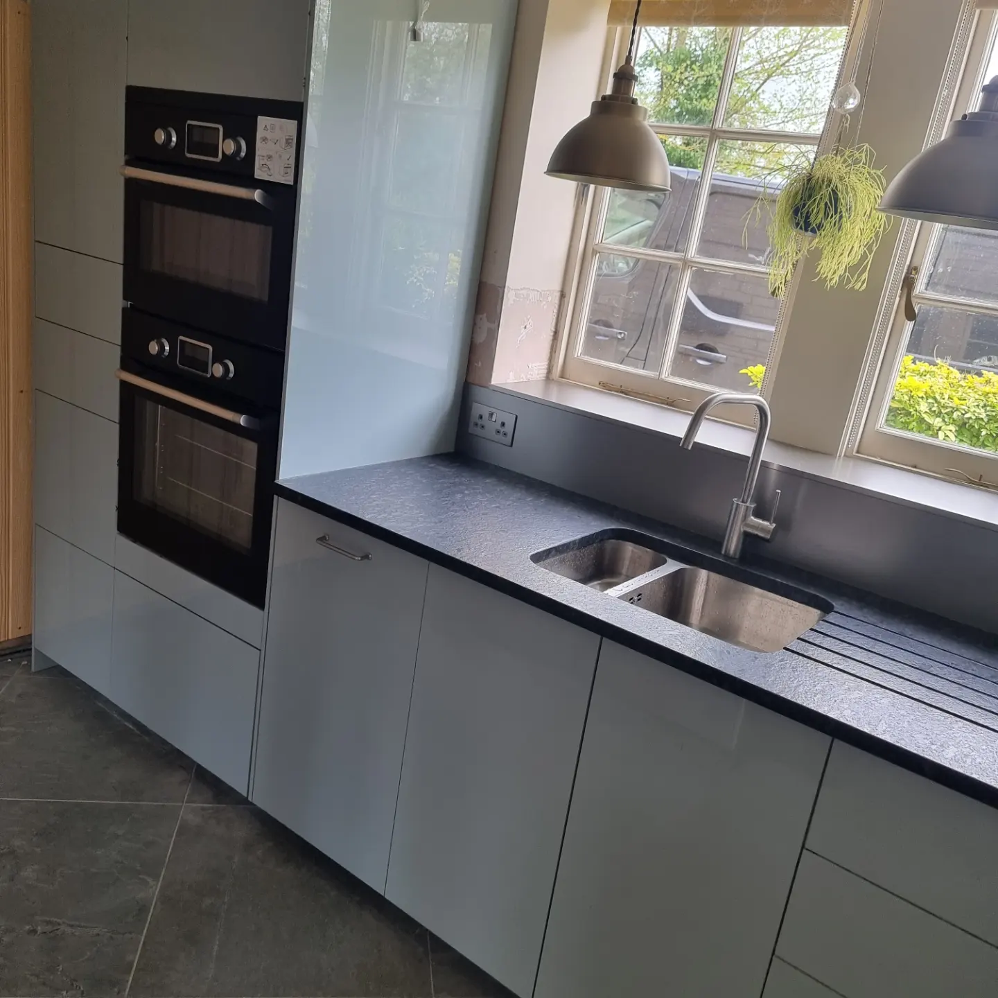 Blue and stainless steel fitted kitchen installed by Paul Lynam in Bradford on Avon