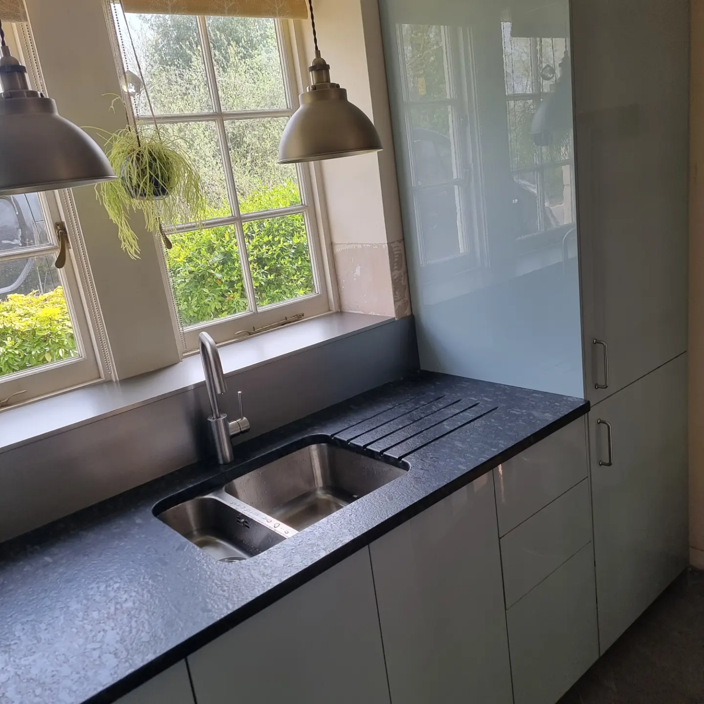 Blue and stainless steel fitted kitchen installed by Paul Lynam in Bradford on Avon