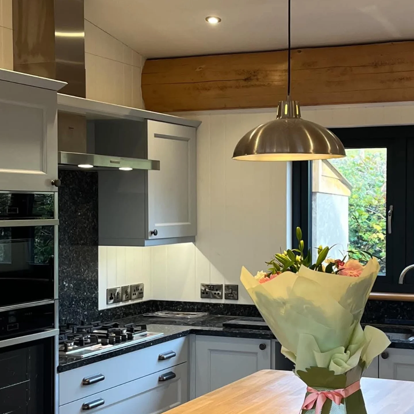 Light grey Shaker-style fitted kitchen installed by Paul Lynam in Bristol