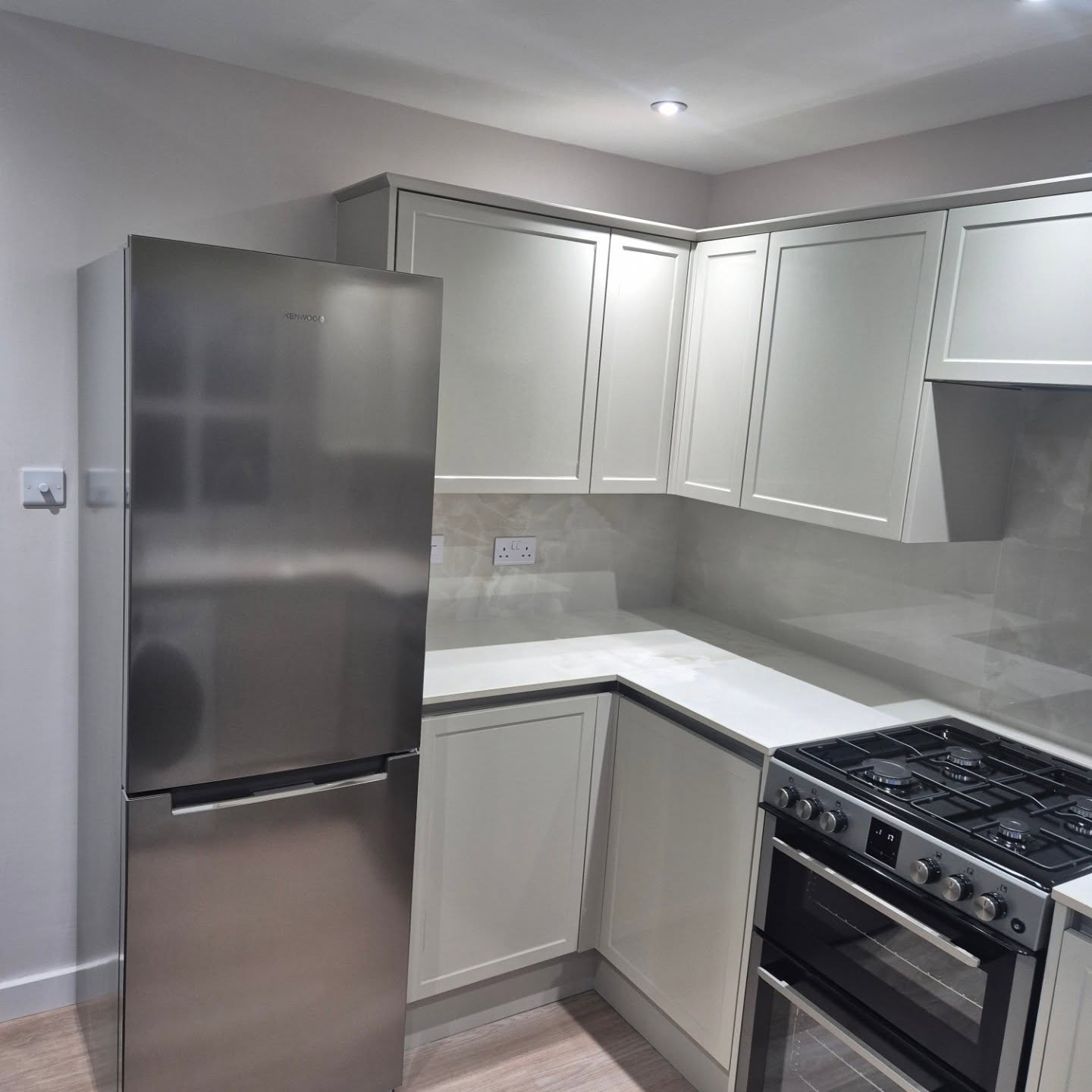 White and grey Shaker-style fitted kitchen installed by Paul Lynam in Peasedown St John