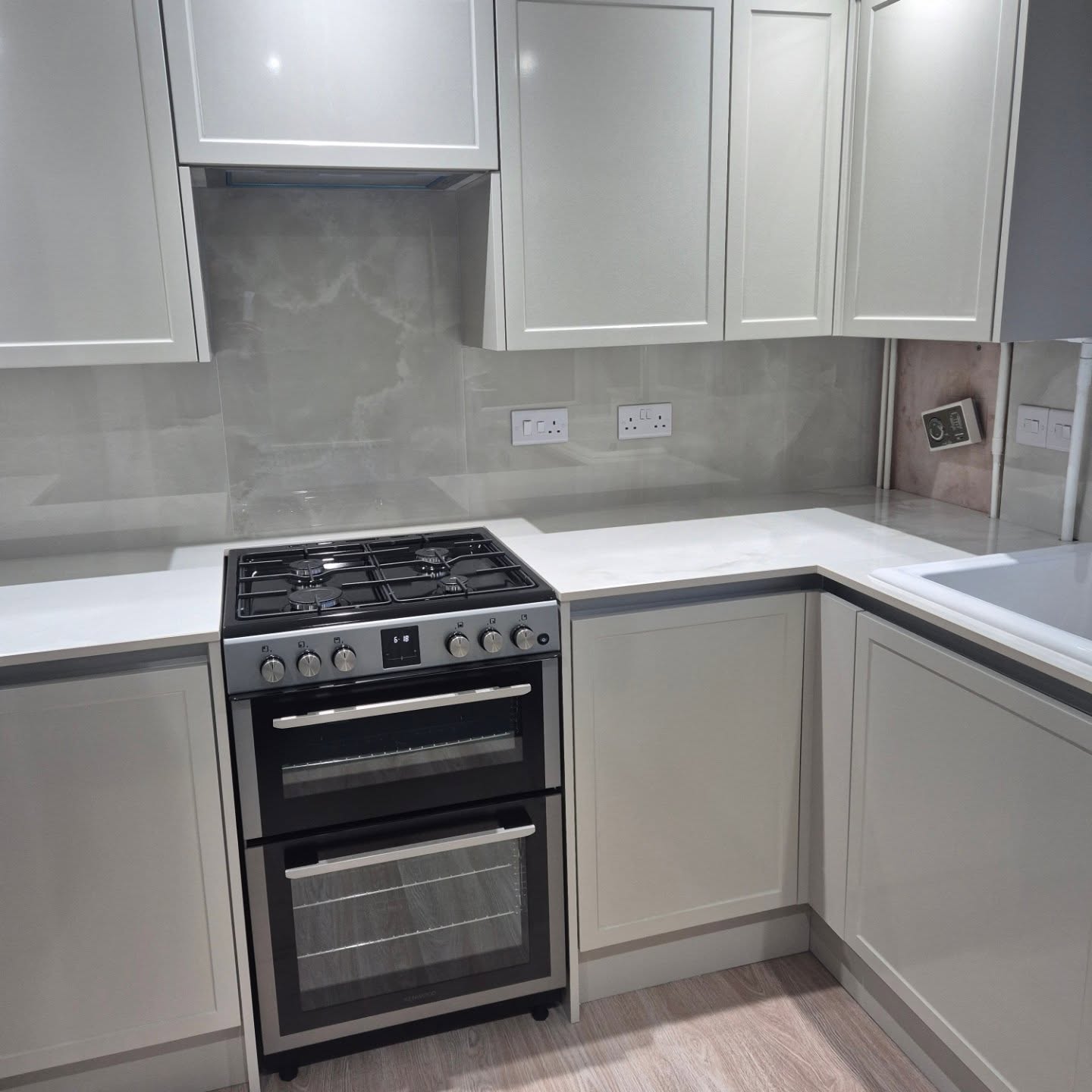 White and grey Shaker-style fitted kitchen installed by Paul Lynam in Peasedown St John